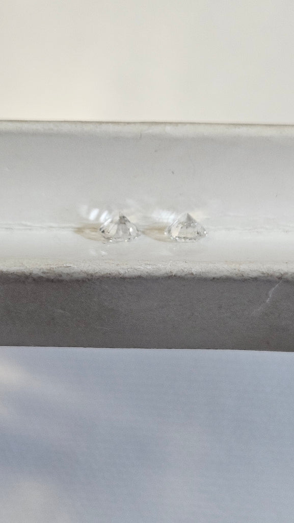 Two Natural Round Diamonds Weighing 0.83 CTW GH I2