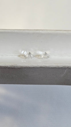 Two Natural Round Diamonds Weighing 0.83 CTW GH I2