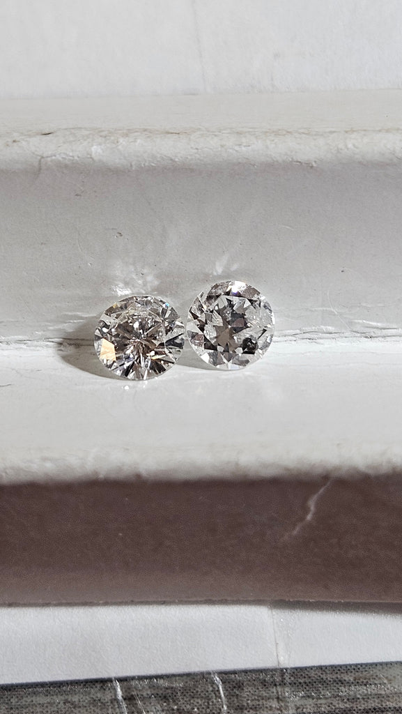 Two Natural Round Diamonds Weighing 0.83 CTW GH I2
