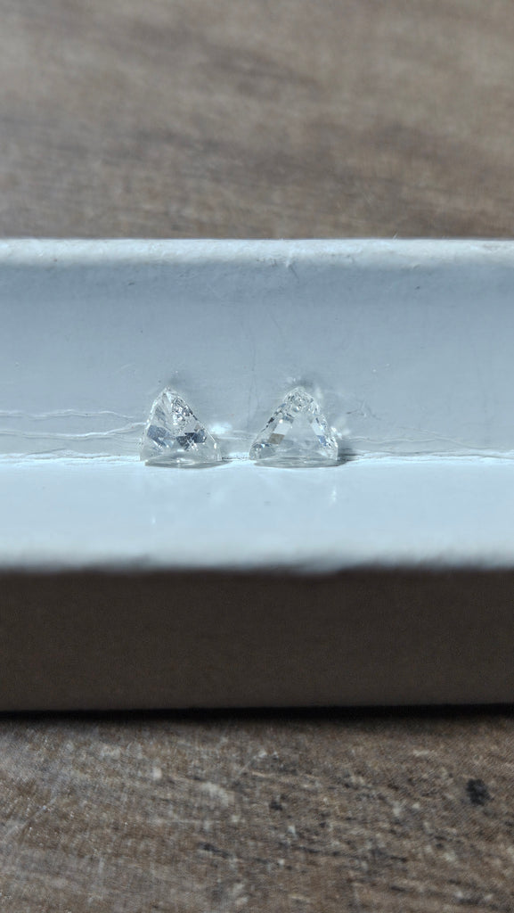 0.53 TCW 2 Natural step-cut Trilliants non-match chipped G-H SI