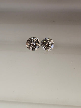 2 Natural Round Diamonds .81 CTW SI (Non match)