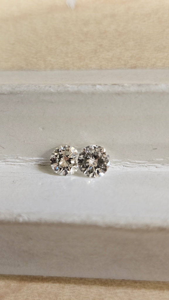 2 Natural Round Diamonds .61 TCW SI (Non Match)