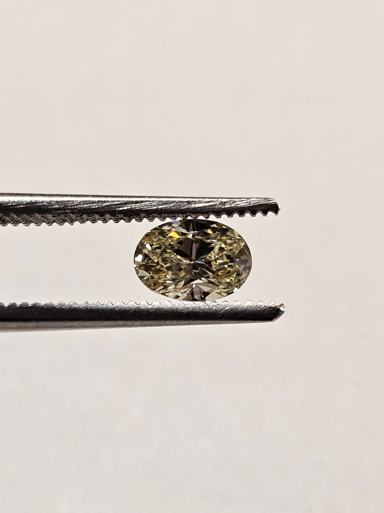 0.65 CT Natural Oval Cut Fancy Yellow - SI2