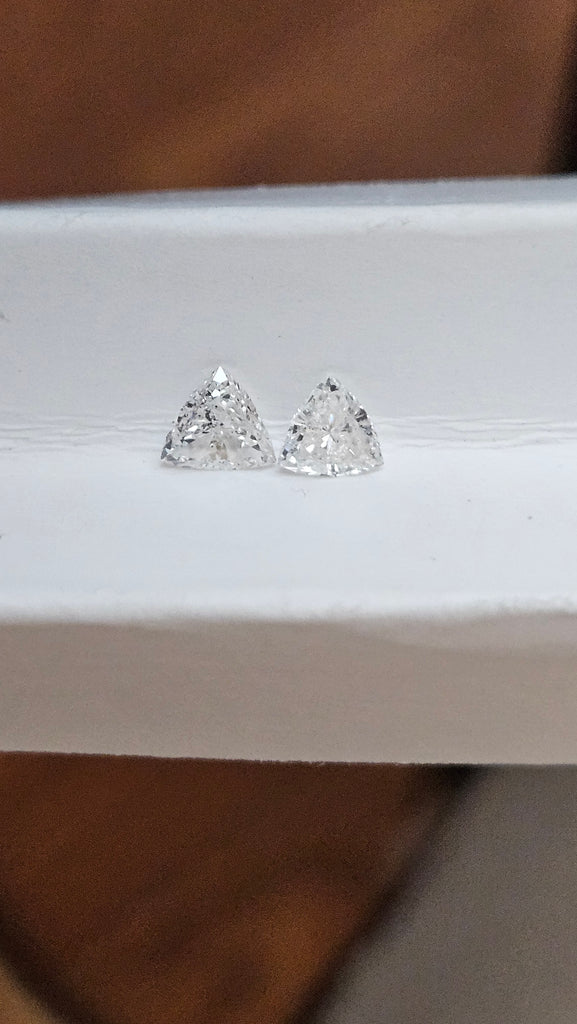 0.61 TCW Natural White Imperfect Trilliant Cuts ( Non-matching )