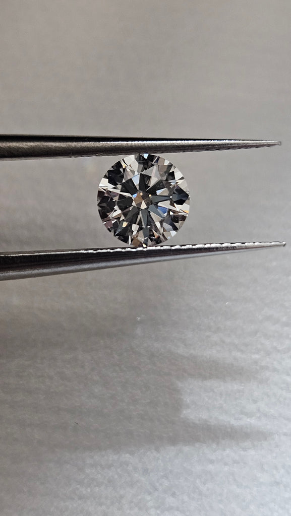 0.76 CT Natural Round J VS1-VS2