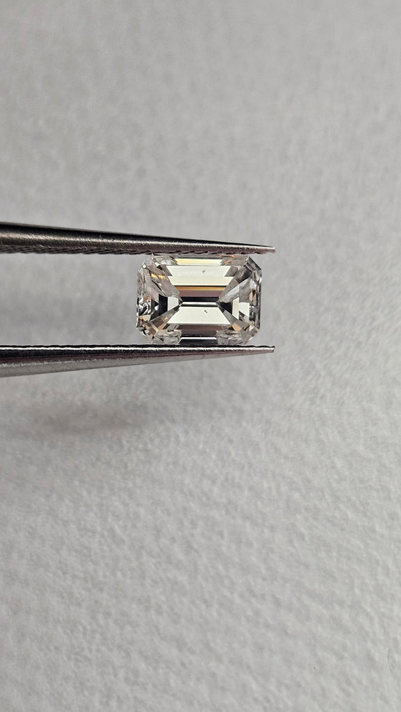 0.74 CT Natural Emerald Cut GH VS * Chipped *