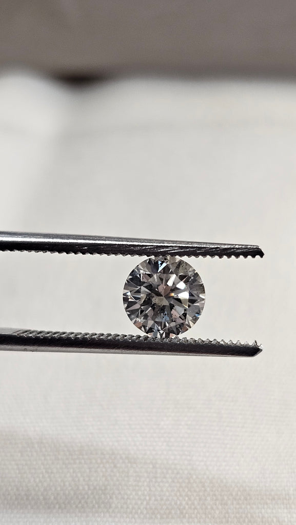 1.11 CT Natural Round Brilliant K I1 tinge-brown