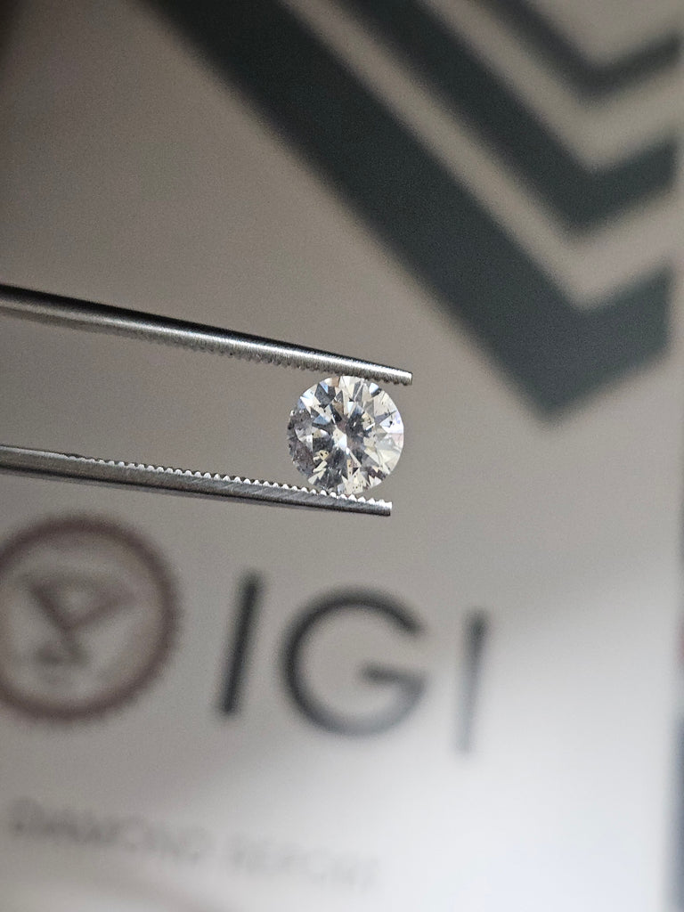 IGI 0.96 CT Natural Round Brilliant Cut E I1 XXX