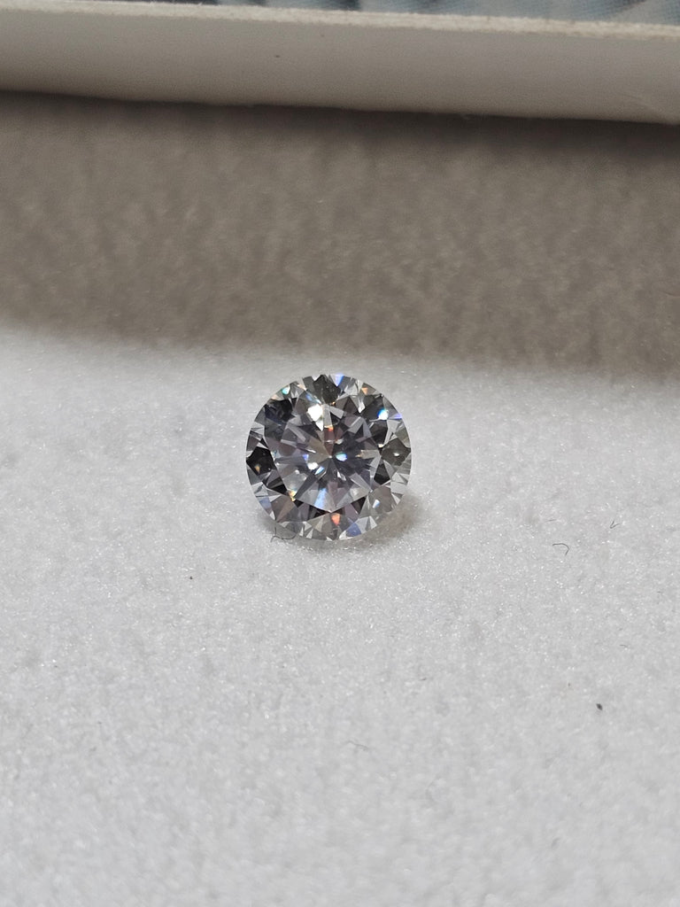 0.49 CT Natural Round Brilliant Blue Tint I1