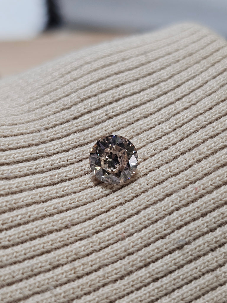0.76 CT Round Diamond K-Faint Brown SI2