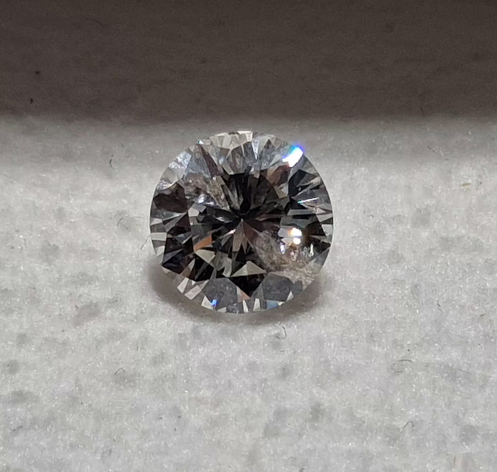 0.77 CT Natural Round Cut IJ Light Undertone I1