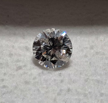 0.77 CT Natural Round Cut IJ Light Undertone I1