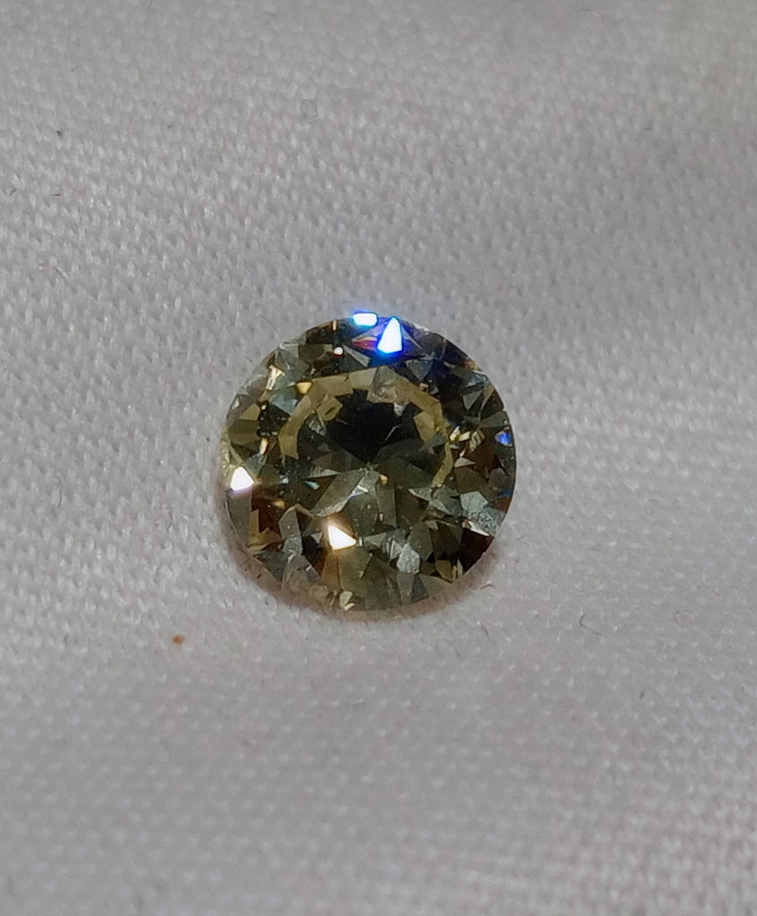 0.59 CT Round Brilliant Natural Diamond M-N VS