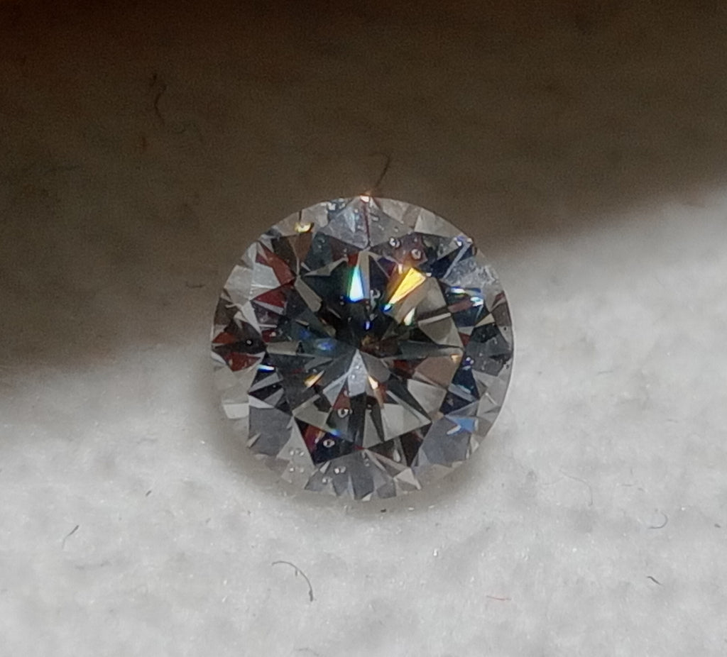 0.59 CT Round Brilliant Natural Diamond G-H SI1 Chipped