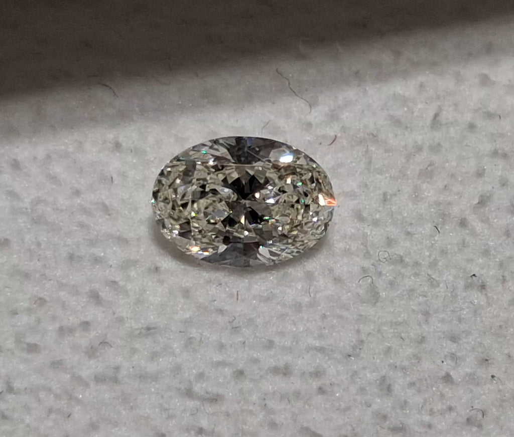 GIA 0.70 CT Natural Oval K SI2