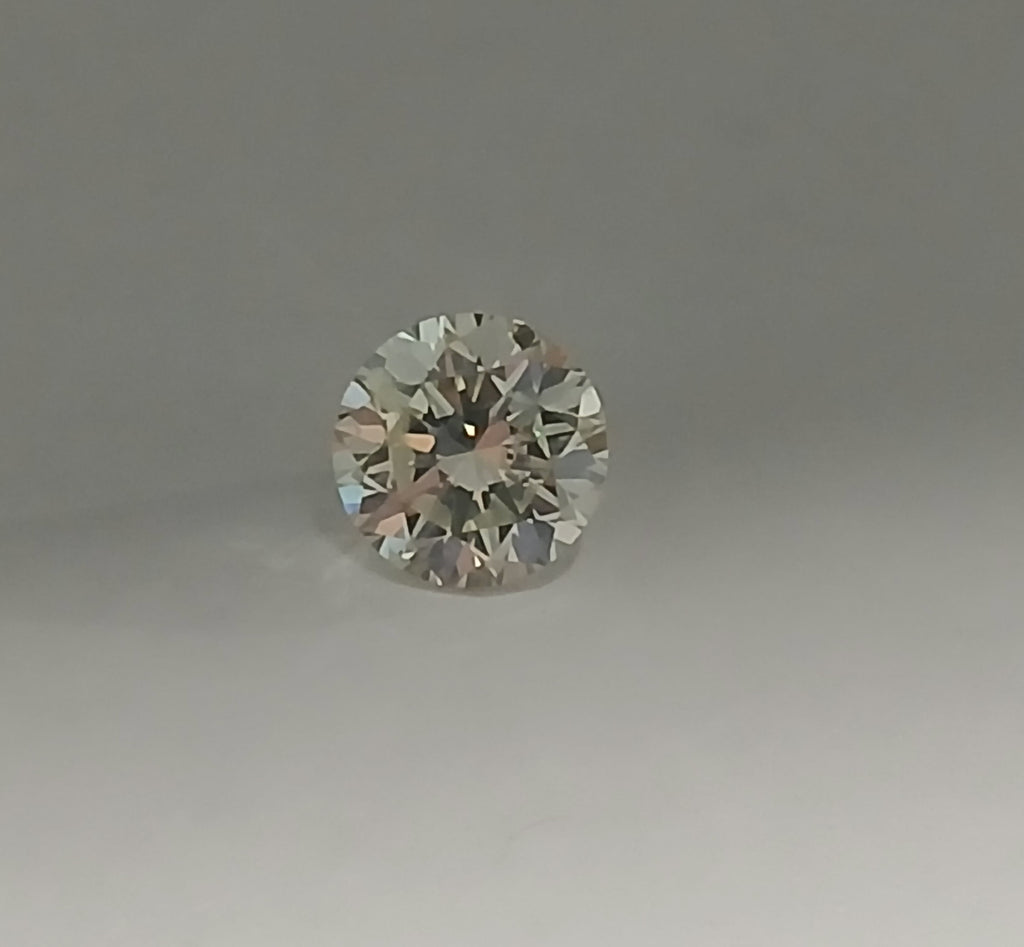 0.71 CT Round Brilliant Natural Diamond M I1