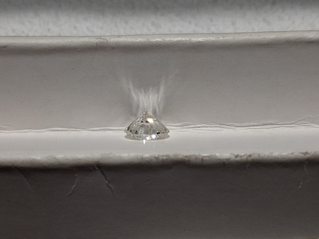 0.78 CT Natural Round Brilliant FG SI1 Chipped